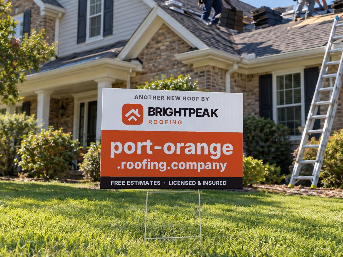 port-orange.roofing.company on a yard sign in front of a house getting a new roof
